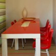 Tavolo. Struttura in legno e piano in resina. Due pezzi.